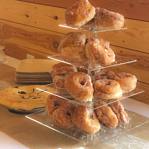 Four tier acrylic dessert stand. This piece is perfect for serving fresh doughnuts, cupcakes, or other sweet treats. Plate sizes are 6