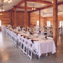 Load image into Gallery viewer, Mid-length rectangle tablecloths set up on a king&#39;s table for a wedding reception at Rugged Horizon.
