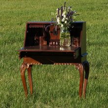 Load image into Gallery viewer, Dark wooden antique desk. Use it as a podium during your wedding ceremony, a sip-n-seat for guests to have a drink as they find their seats, or as a welcome table. 
